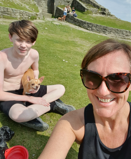 Mum and son smiling in the sun